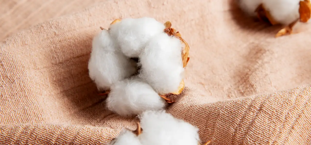 Raw recycled cotton on sustainable textile fabric