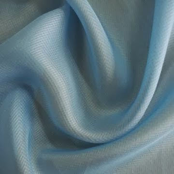 Light blue semi-synthetic fabric with a soft weave, combining natural and synthetic fibers.