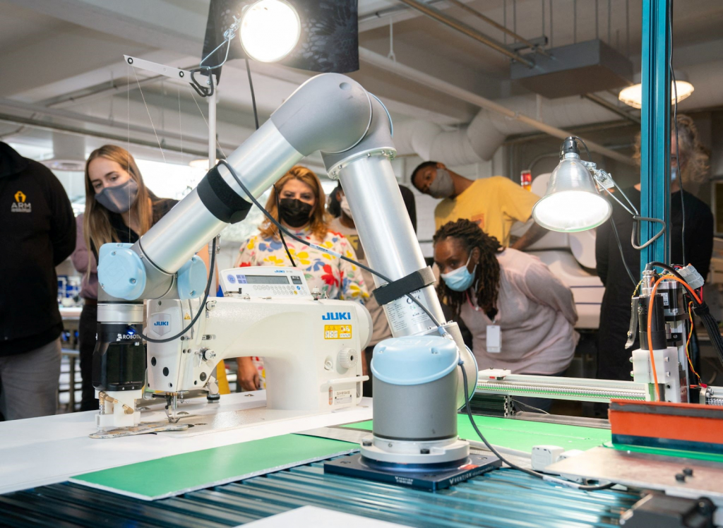 AI-powered robotic sewing machine automating fabric manufacturing process in textile industry 2025