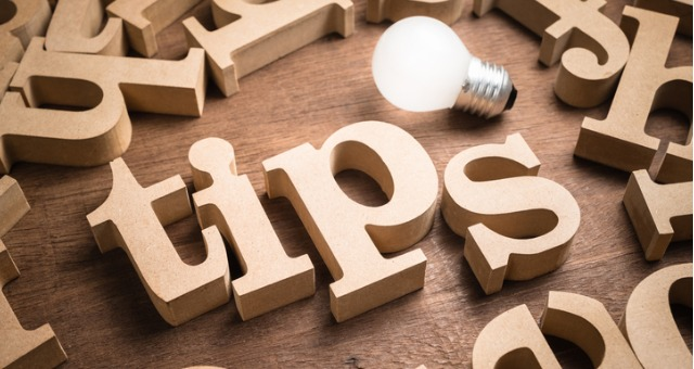 Wooden letters spelling tips with a glowing lightbulb – helpful guidance for teens choosing the right stream after 10th