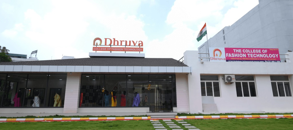 Dhruva College of Fashion Technology Hyderabad campus exterior showcasing traditional Indian fashion textiles and colorful display on building facade