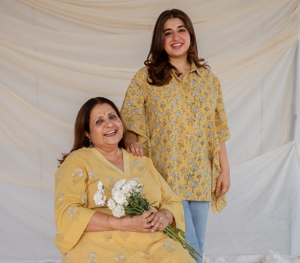 Hetal Desai and her daughter, founders of The Indian Ethnic Co., wearing yellow block-printed ethnic Indian wear.